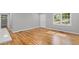 Bright living room featuring newly refinished hardwood floors and a fresh coat of paint at 2889 Macon Sw Dr, Atlanta, GA 30354