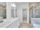 Elegant bathroom with double sinks, tiled shower, and neutral color palette for a spa-like retreat at 3269 Shirecrest Ln, Dacula, GA 30019