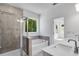 This bathroom features a glass-enclosed shower, tub, and double vanity at 3269 Shirecrest Ln, Dacula, GA 30019