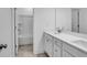Modern bathroom featuring double vanity with white countertops and tile flooring next to a tub and shower at 3269 Shirecrest Ln, Dacula, GA 30019