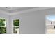 Bright bedroom with large windows and a tray ceiling at 3269 Shirecrest Ln, Dacula, GA 30019