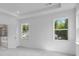 Bright bedroom with large windows and a tray ceiling at 3269 Shirecrest Ln, Dacula, GA 30019