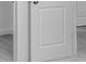 Detail of a door, painted white with a simple square design at 3269 Shirecrest Ln, Dacula, GA 30019