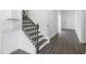 Hallway leading into home features luxury vinyl plank flooring and staircase at 3269 Shirecrest Ln, Dacula, GA 30019