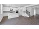 Bright kitchen features white cabinets, a large island, stainless steel appliances, and stylish pendant lighting at 3269 Shirecrest Ln, Dacula, GA 30019