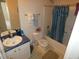 Functional bathroom featuring a shower-tub combination and classic fixtures, complete with bright lighting at 6179 Swabia Ln, Stone Mountain, GA 30087