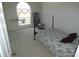 Comfortable bedroom with a floral comforter, natural light, and a relaxing atmosphere at 6179 Swabia Ln, Stone Mountain, GA 30087