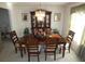 Elegant dining room with a large wooden table, decorative lighting, and ample seating at 6179 Swabia Ln, Stone Mountain, GA 30087