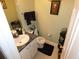 Well-maintained half bathroom with a granite countertop and decorative fixtures at 6179 Swabia Ln, Stone Mountain, GA 30087