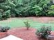 Well-maintained backyard with flowerbeds at 1818 Brandy Woods Se Dr, Conyers, GA 30013