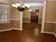 Dining room showing large wall mirror, chandelier, tile flooring, neutral walls, and trim at 1818 Brandy Woods Se Dr, Conyers, GA 30013