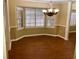 Bright dining room with a bay window, tile floors, and elegant chandelier at 1818 Brandy Woods Se Dr, Conyers, GA 30013