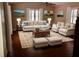 Comfortable living room with area rug, neutral colors, lots of light, ceiling fan and furniture at 1818 Brandy Woods Se Dr, Conyers, GA 30013