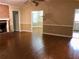 Living room featuring hardwood floors and a fireplace, with an adjacent dining area at 1818 Brandy Woods Se Dr, Conyers, GA 30013