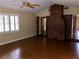Bright living area with hardwood floors, brick fireplace, and neutral paint at 1818 Brandy Woods Se Dr, Conyers, GA 30013