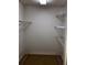 Spacious walk-in closet with wire shelving, carpeted floor and white walls at 1818 Brandy Woods Se Dr, Conyers, GA 30013