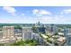 Expansive aerial view of the city skyline, highlighting the buildings, lush green landscape and clear blue sky at 2881 Peachtree Ne Rd # 1102, Atlanta, GA 30305