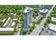 A high-rise condo building with lush greenery surrounding the exterior and nearby at 2881 Peachtree Ne Rd # 1102, Atlanta, GA 30305