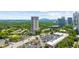 Scenic aerial of a high-rise residential building surrounded by lush greenery, with views of the cityscape at 2881 Peachtree Ne Rd # 1102, Atlanta, GA 30305