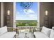 Relaxing outdoor terrace seating area offers stunning city and treetop views from this high-rise residence at 2881 Peachtree Ne Rd # 1102, Atlanta, GA 30305