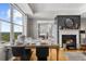Bright dining room showcasing a fireplace and beautiful outdoor views at 2881 Peachtree Ne Rd # 1102, Atlanta, GA 30305