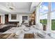 Dining area with seating, city views, an open living space and adjoining bedroom with king bed at 2881 Peachtree Ne Rd # 1102, Atlanta, GA 30305