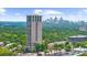 A high-rise building overlooking lush greenery and the city skyline at 2881 Peachtree Ne Rd # 1102, Atlanta, GA 30305