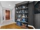 Hallway featuring a decorative bookshelf, wood floors, and a neutral palette at 2881 Peachtree Ne Rd # 1102, Atlanta, GA 30305