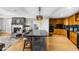 Stylish eat-in kitchen with stainless steel appliances and an adjoining fireplace living area at 2881 Peachtree Ne Rd # 1102, Atlanta, GA 30305