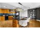 Open concept kitchen featuring a large island, stainless appliances, and wood cabinetry at 2881 Peachtree Ne Rd # 1102, Atlanta, GA 30305