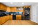 Updated kitchen with wood cabinets, stainless appliances, and granite countertops at 2881 Peachtree Ne Rd # 1102, Atlanta, GA 30305