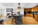 Open-concept kitchen featuring a bar area, hardwood floors, and modern appliances at 2881 Peachtree Ne Rd # 1102, Atlanta, GA 30305