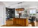 Open concept kitchen with a granite-topped island and contemporary lighting fixture at 2881 Peachtree Ne Rd # 1102, Atlanta, GA 30305