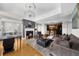 Open layout showcasing a living area with fireplace, dining space, and a modern kitchen for seamless living at 2881 Peachtree Ne Rd # 1102, Atlanta, GA 30305