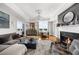 Open living space featuring a fireplace, hardwood floors, elegant chandelier, and comfortable seating at 2881 Peachtree Ne Rd # 1102, Atlanta, GA 30305