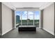 Bright room with a large window showcasing cityscape views, complemented by comfortable seating, and neutral decor at 2881 Peachtree Ne Rd # 1102, Atlanta, GA 30305
