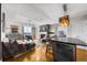 Open-concept living space featuring a fireplace, city views, a dining space, and a sleek kitchen area at 2881 Peachtree Ne Rd # 1102, Atlanta, GA 30305