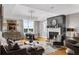 Cozy living room with fireplace, chandelier, and neutral furnishings at 2881 Peachtree Ne Rd # 1102, Atlanta, GA 30305