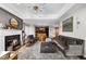 Bright and airy open living room with a fireplace, hardwood floors, and access to the kitchen at 2881 Peachtree Ne Rd # 1102, Atlanta, GA 30305