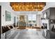 A view of an open concept living room space with a kitchen island featuring granite countertop at 2881 Peachtree Ne Rd # 1102, Atlanta, GA 30305
