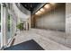 Grand lobby space with water feature, large windows, and tiled floor at 2881 Peachtree Ne Rd # 1102, Atlanta, GA 30305