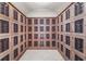 A spacious wine cellar featuring custom wood cabinets with metal lattice doors, providing ample storage for an extensive collection at 2881 Peachtree Ne Rd # 1102, Atlanta, GA 30305