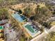 Aerial view of community tennis courts and a partially covered swimming pool at 307 Cedar Dust Dr, Decatur, GA 30030