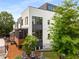A private backyard features a wood deck, a seating area, a fenced-in area, and lots of green trees at 307 Cedar Dust Dr, Decatur, GA 30030