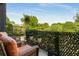Relaxing balcony space featuring comfortable furniture and views of lush greenery in the distance at 307 Cedar Dust Dr, Decatur, GA 30030