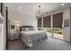 Comfortable bedroom with a large window and patterned window treatments for privacy at 307 Cedar Dust Dr, Decatur, GA 30030