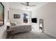 Modern bedroom featuring neutral color palette, ceiling fan, tv and comfortable decor at 307 Cedar Dust Dr, Decatur, GA 30030