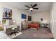 Spacious bedroom with two desks, a ceiling fan, and unique wall decor, offering ample study and relaxation space at 307 Cedar Dust Dr, Decatur, GA 30030