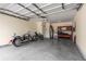 Spacious two-car garage equipped with overhead storage and a motorcycle at 307 Cedar Dust Dr, Decatur, GA 30030