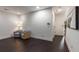 Hallway boasts hardwood floors, neutral paint, and two chairs beneath a lamp at 307 Cedar Dust Dr, Decatur, GA 30030